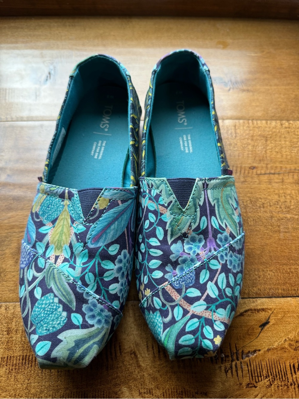 TOMS Women's Floral Canvas Slip-Ons in Teal and Purple